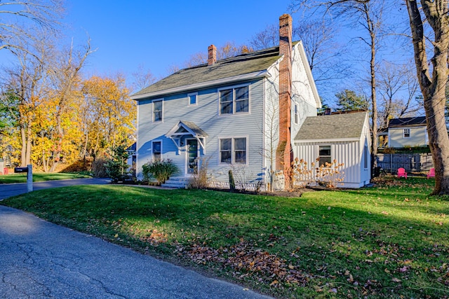 28 Stone Dr, Cape Elizabeth, ME 04107 - view of front of house with a chimney and board and batten siding