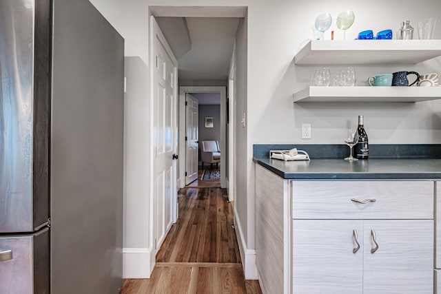 28 Stone Dr, Cape Elizabeth, ME 04107 - indoor dry bar featuring freestanding refrigerator, wood finished floors, and baseboards