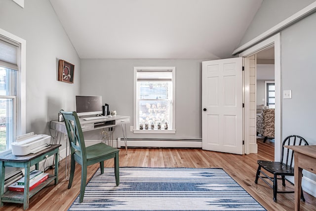 28 Stone Dr, Cape Elizabeth, ME 04107 - office area featuring vaulted ceiling, a baseboard radiator, and light wood-style flooring