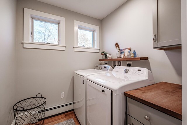 28 Stone Dr, Cape Elizabeth, ME 04107 - laundry area with cabinet space, independent washer and dryer, a baseboard radiator, and wood finished floors