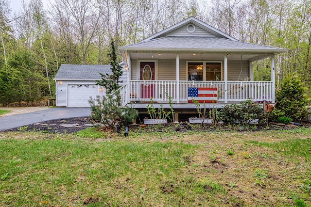 55 Reservoir Rd, Paris, ME 04281 - view of front of home with a porch, asphalt driveway, roof with shingles, and an attached garage