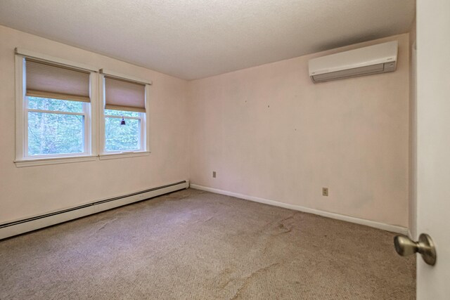 55 Reservoir Rd, Paris, ME 04281 - carpeted spare room featuring a wall unit AC, baseboard heating, and baseboards
