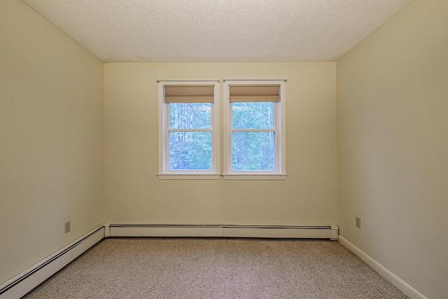 55 Reservoir Rd, Paris, ME 04281 - unfurnished room featuring light carpet, a baseboard radiator, baseboards, and a textured ceiling