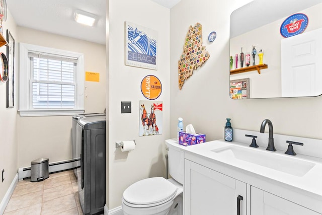 333 N St Unit 5, Saco, ME 04072 - bathroom featuring washer / dryer, a baseboard radiator, baseboards, and toilet