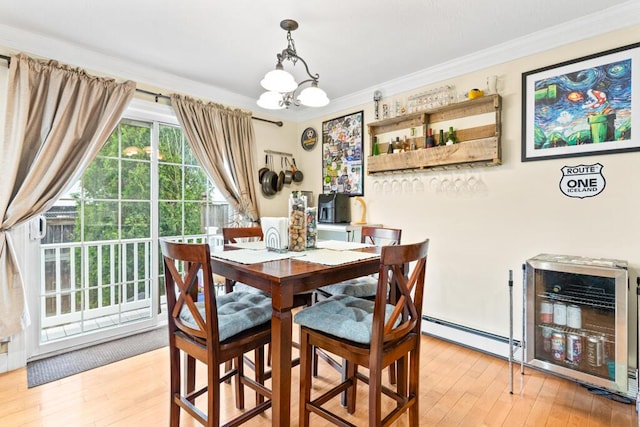 333 N St Unit 5, Saco, ME 04072 - dining room featuring hardwood / wood-style flooring, a chandelier, and crown molding
