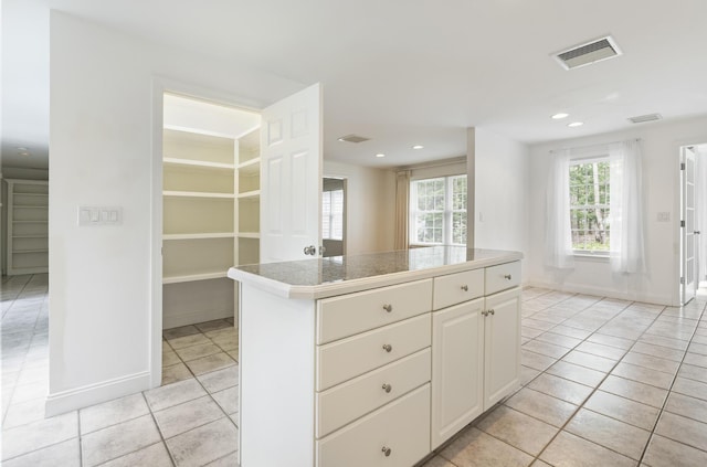 5 Honeysuckle Ln, Scarborough, ME 04074 - kitchen featuring light tile patterned floors, baseboards, recessed lighting, a kitchen island, and tile counters