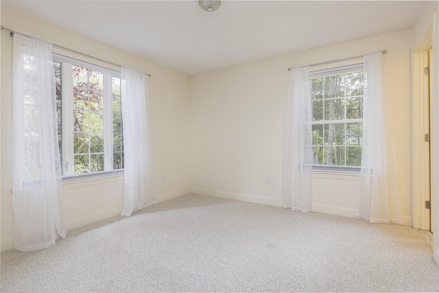 5 Honeysuckle Ln, Scarborough, ME 04074 - spare room with plenty of natural light, carpet flooring, and baseboards