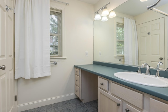 5 Honeysuckle Ln, Scarborough, ME 04074 - bathroom featuring baseboards and vanity