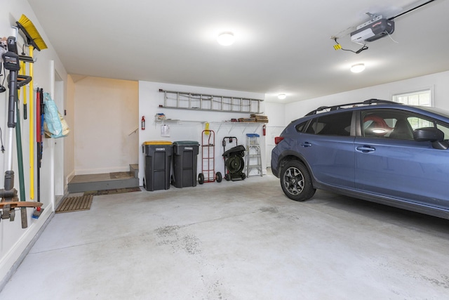 5 Honeysuckle Ln, Scarborough, ME 04074 - garage with a garage door opener