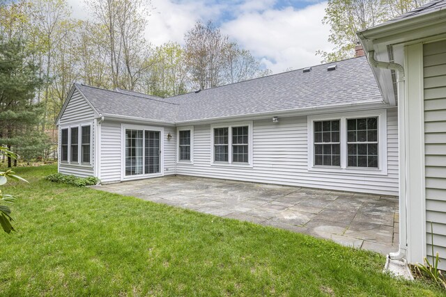 5 Honeysuckle Ln, Scarborough, ME 04074 - back of house featuring a shingled roof, a patio, and a lawn