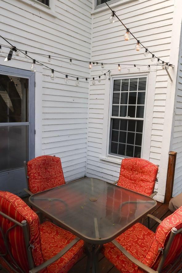 56 Savage St, Bangor, ME 04401 - wooden terrace featuring outdoor dining space