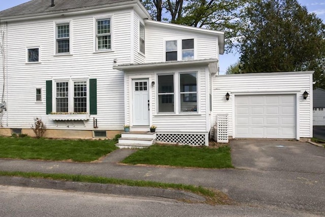56 Savage St, Bangor, ME 04401 - view of front of property with entry steps, a garage, and asphalt driveway