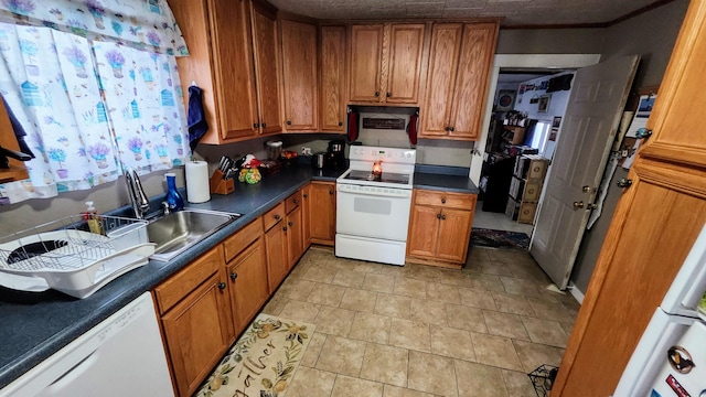 295 Grove St, Bangor, ME 04401 - kitchen with white appliances and brown cabinetry
