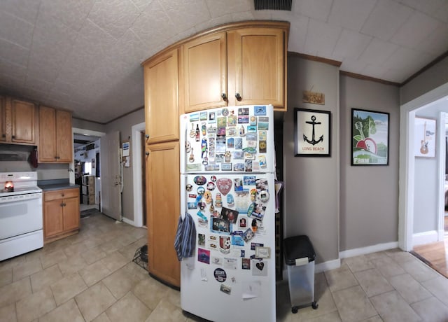 295 Grove St, Bangor, ME 04401 - kitchen with white appliances, light tile patterned floors, and baseboards