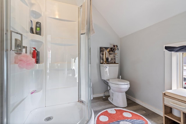192 Wilson St, Brewer, ME 04412 - full bath featuring wood finished floors, a shower stall, vaulted ceiling, toilet, and baseboards