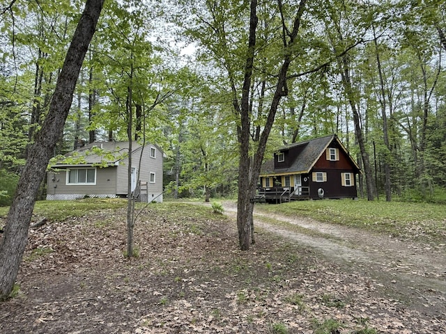 26-28 Acorn Rd, Naples, ME 04055 - view of front facade with dirt driveway