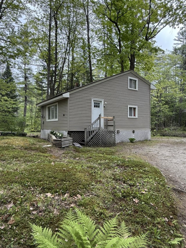 26-28 Acorn Rd, Naples, ME 04055 - back of property featuring view of scattered trees