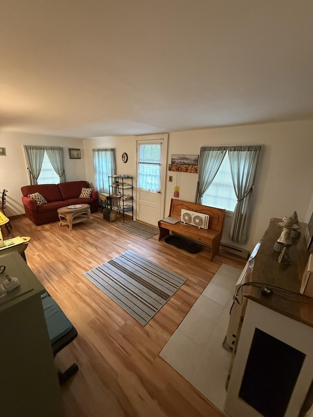 26-28 Acorn Rd, Naples, ME 04055 - living room with healthy amount of natural light and wood finished floors