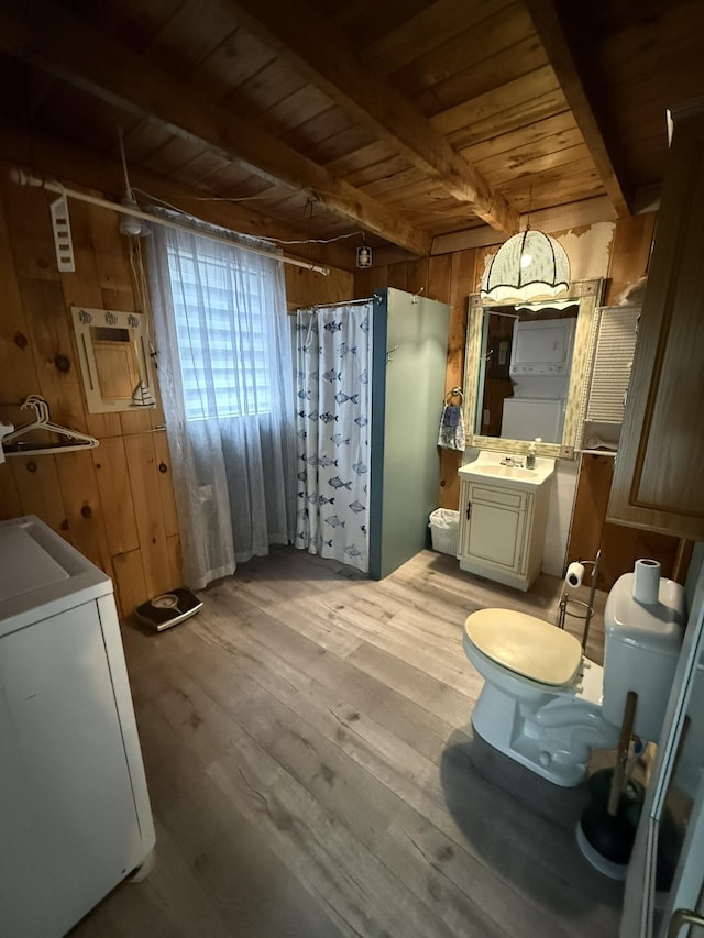 26-28 Acorn Rd, Naples, ME 04055 - full bathroom with washer / dryer, wooden ceiling with exposed beams, vanity, a shower with shower curtain, and wood walls