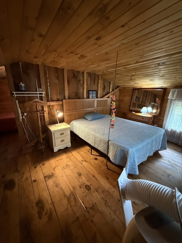 26-28 Acorn Rd, Naples, ME 04055 - bedroom with hardwood / wood-style flooring, wood walls, and wooden ceiling