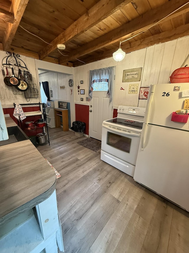 26-28 Acorn Rd, Naples, ME 04055 - kitchen with white appliances, wooden ceiling with exposed beams, and wood finished floors