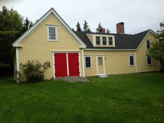 579 Cranberry Rd, Great Cranberry, Cranberry Isles, ME 04625 - rear view of property with a lawn, a chimney, and roof with shingles