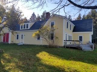 579 Cranberry Rd, Great Cranberry, Cranberry Isles, ME 04625 - back of property featuring a yard, a chimney, and a wooden deck