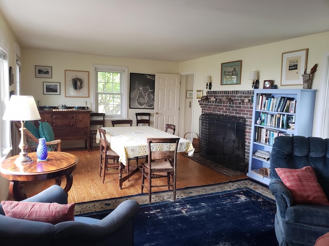 579 Cranberry Rd, Great Cranberry, Cranberry Isles, ME 04625 - dining room featuring wood finished floors and a brick fireplace