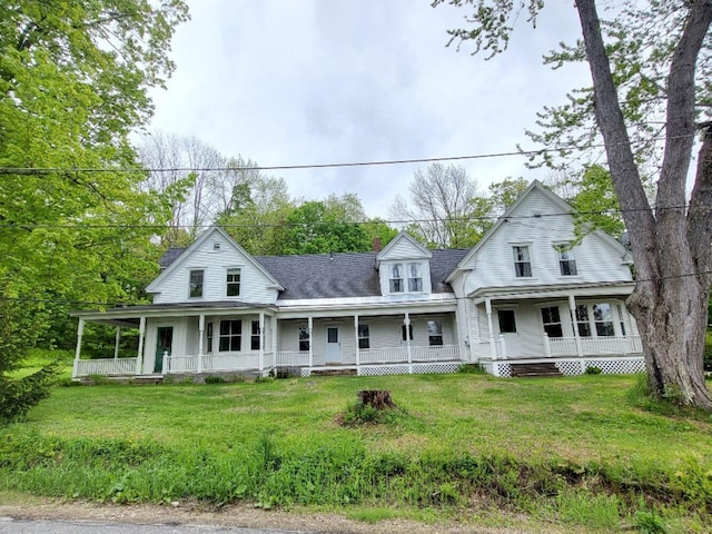 15 Highland Ave, Wilton, ME 04294 - farmhouse inspired home with a porch, a front lawn, and roof with shingles