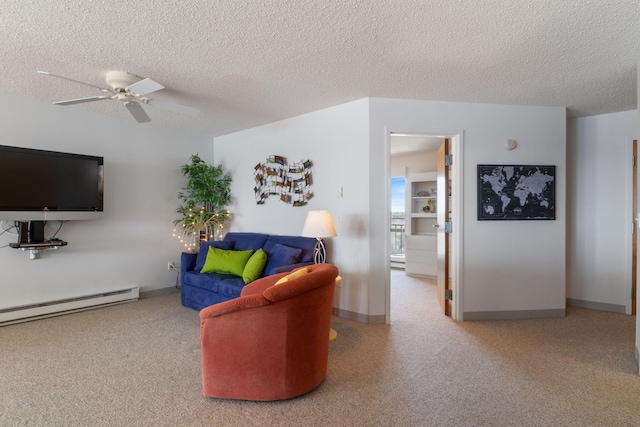 205 E Grand Ave Unit 7E, Old Orchard Beach, ME 04064 - carpeted living area with a textured ceiling, a baseboard radiator, a ceiling fan, and baseboards