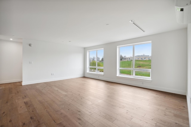218 Washington Ave Unit 309, Portland, ME 04101 - empty room with baseboards, wood-type flooring, and recessed lighting