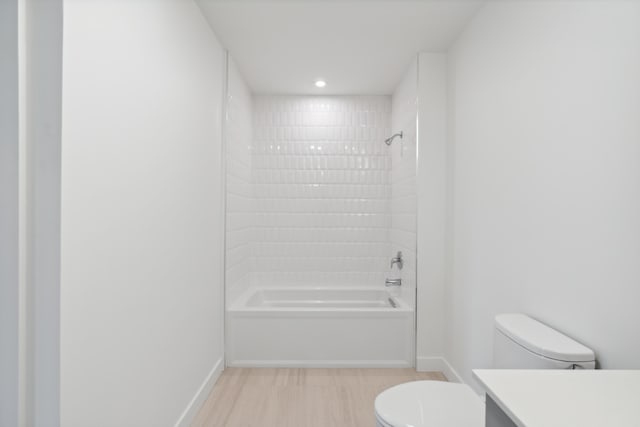 218 Washington Ave Unit 309, Portland, ME 04101 - bathroom with toilet, vanity, shower / tub combination, baseboards, and recessed lighting