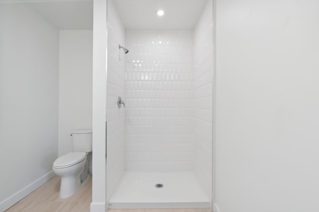 218 Washington Ave Unit 309, Portland, ME 04101 - bathroom featuring a stall shower, toilet, baseboards, and recessed lighting