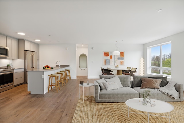 218 Washington Ave Unit 309, Portland, ME 04101 - living area with recessed lighting and light wood-style flooring