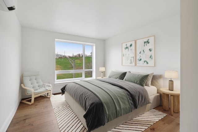 218 Washington Ave Unit 309, Portland, ME 04101 - bedroom featuring hardwood / wood-style floors and baseboards