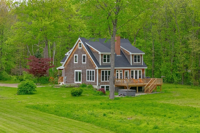 6 Bluebird Way, Kennebunk, ME 04043 - back of house featuring a deck, a yard, a forest view, a chimney, and a hot tub