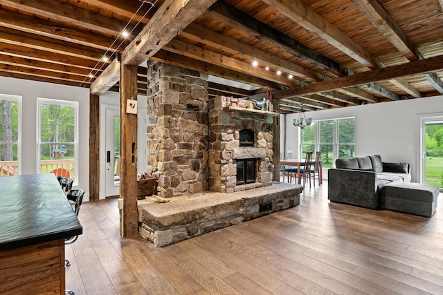 6 Bluebird Way, Kennebunk, ME 04043 - living area featuring wood-type flooring, beam ceiling, and a fireplace