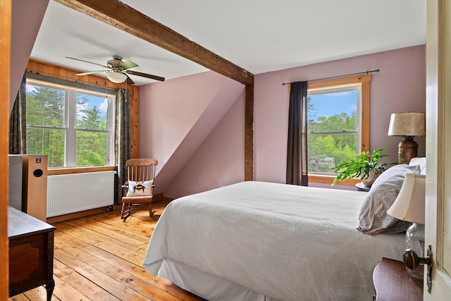6 Bluebird Way, Kennebunk, ME 04043 - bedroom with radiator, light wood-type flooring, multiple windows, and a ceiling fan