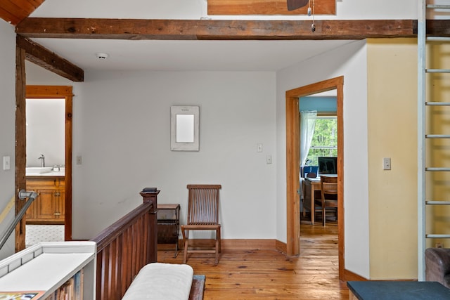 6 Bluebird Way, Kennebunk, ME 04043 - bedroom featuring light wood finished floors, beamed ceiling, a sink, and ensuite bathroom