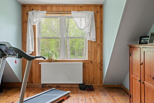 6 Bluebird Way, Kennebunk, ME 04043 - exercise room with radiator, baseboards, hardwood / wood-style floors, and wooden walls