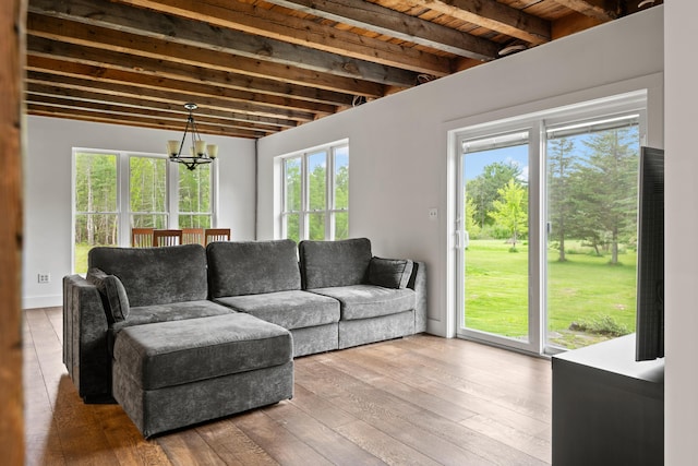 6 Bluebird Way, Kennebunk, ME 04043 - living room with beam ceiling, hardwood / wood-style flooring, and a chandelier