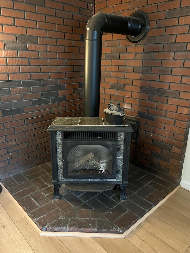 detailed view of a wood stove and wood finished floors