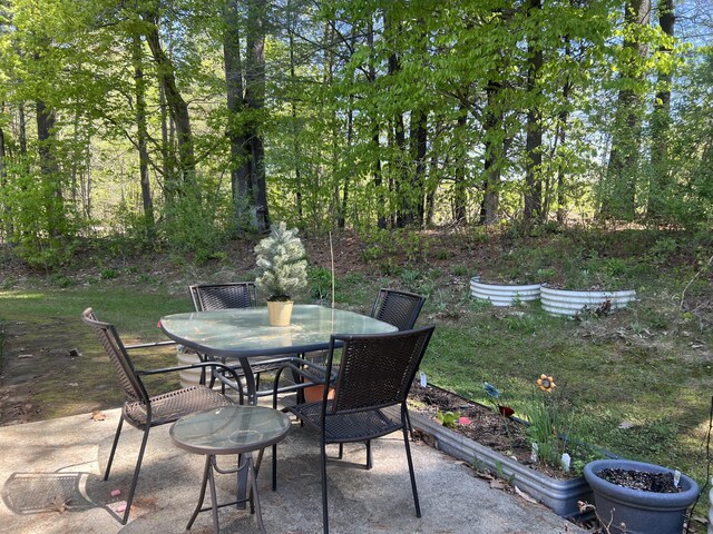 view of patio featuring outdoor dining area