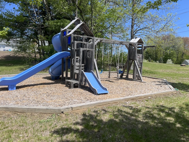 community play area featuring a lawn