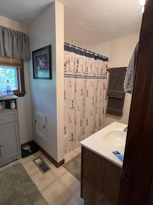41 Winter St, Lisbon, ME 04250 - bathroom with tile patterned floors, vanity, and curtained shower