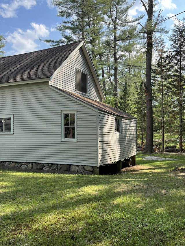 41 Winter St, Lisbon, ME 04250 - view of property exterior with a shingled roof and a yard