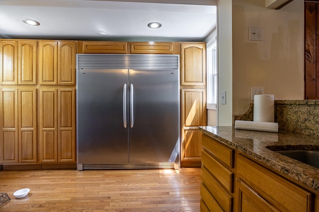 23 Paul St, South Berwick, ME 03908 - kitchen featuring built in refrigerator, dark stone countertops, light wood finished floors, and recessed lighting