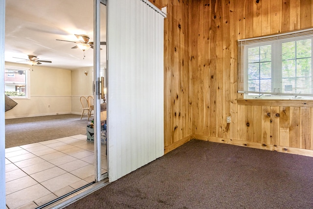 23 Paul St, South Berwick, ME 03908 - carpeted empty room featuring wooden walls, ceiling fan, and baseboards
