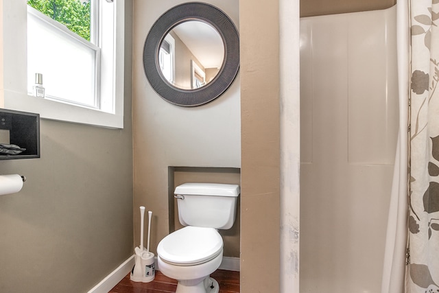 23 Paul St, South Berwick, ME 03908 - full bath featuring toilet, baseboards, wood finished floors, and a shower with shower curtain