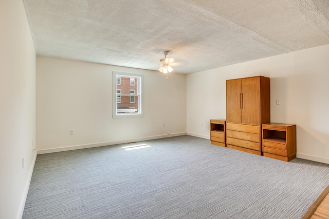 23 Paul St, South Berwick, ME 03908 - spare room featuring a ceiling fan, a textured ceiling, baseboards, and carpet floors
